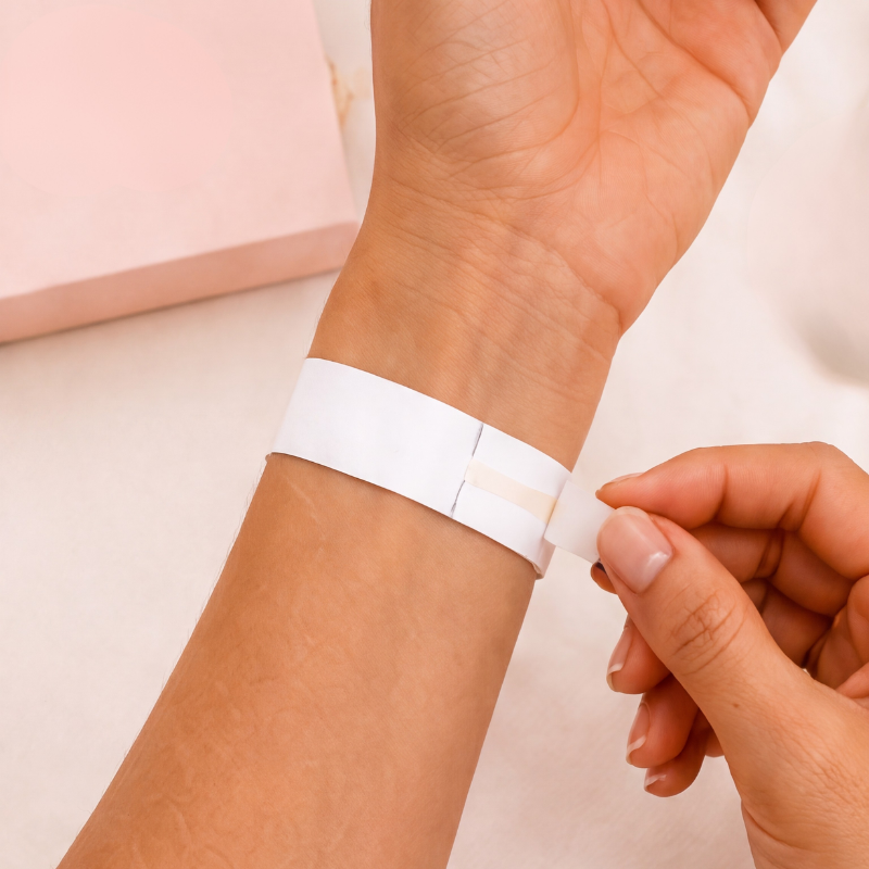 Paper strip wrapped around a wrist and taped in place